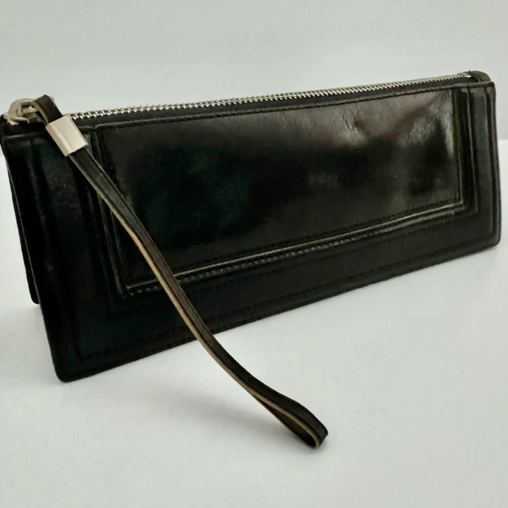 Ellen Tracy Black Leather Clutch with red logo interior.